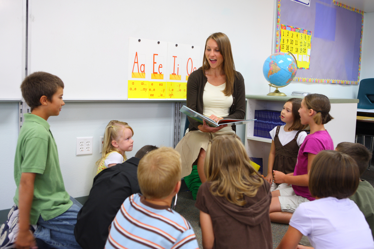 Teacher reading book to class